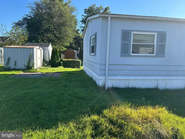 a view of a backyard of the house