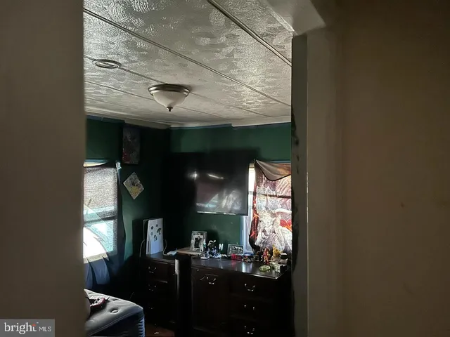 a room with fireplace furniture and a window