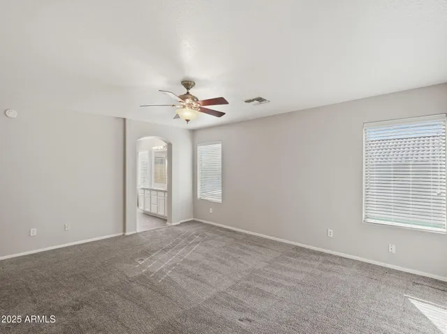 a view of an empty room with a window