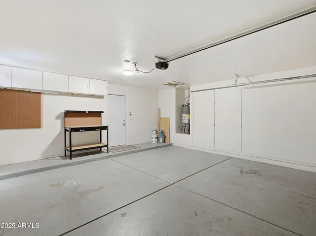 a view of an empty room with empty shelves