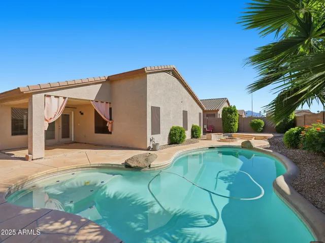 a house view with a swimming pool