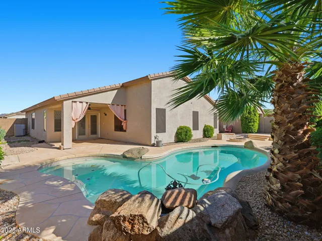 a front view of house with yard and seating area
