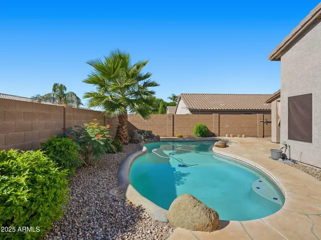 a view of a house with a sink and yard