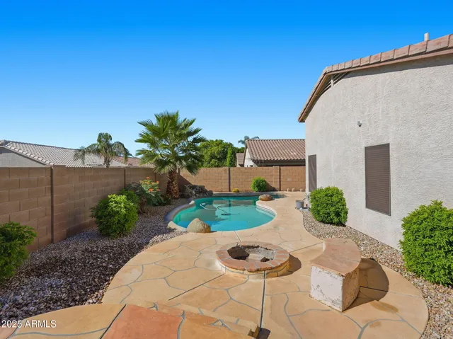 a view of a backyard with potted plants