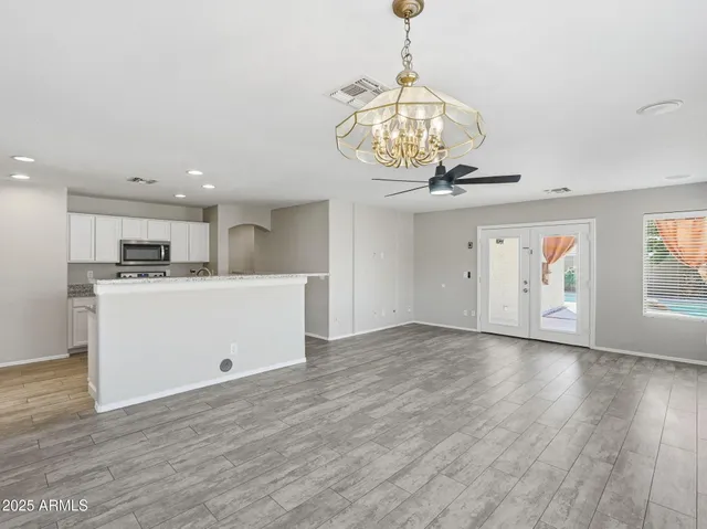 a view of a kitchen with a sink and a refrigerator