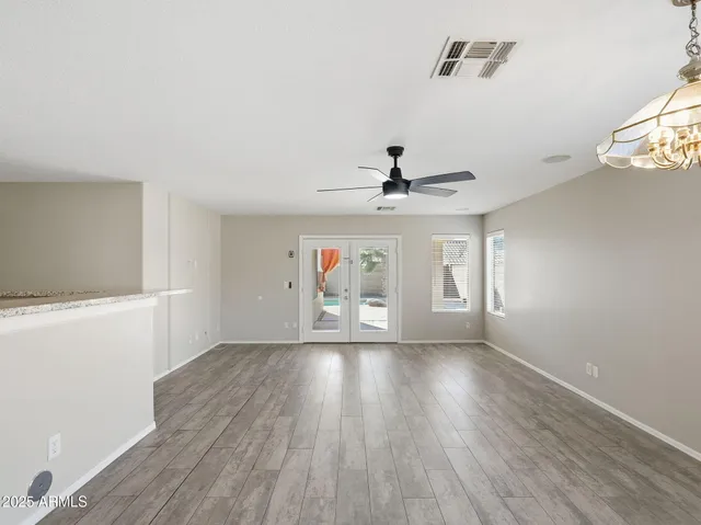 a view of a kitchen with a sink stainless steel appliances and cabinets