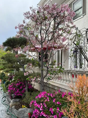a view of an empty room with a fireplace and a window