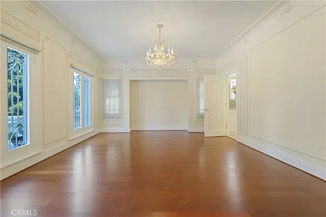 a view of an entryway with wooden floor and garden
