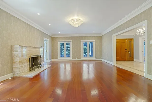 a kitchen with white cabinets and appliances