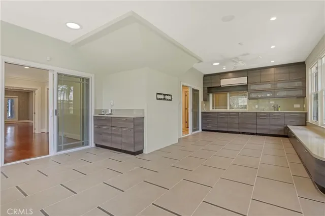 a view of a house with a yard and a patio