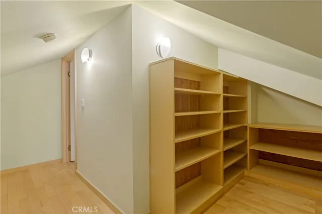 a view of a balcony with wooden floor