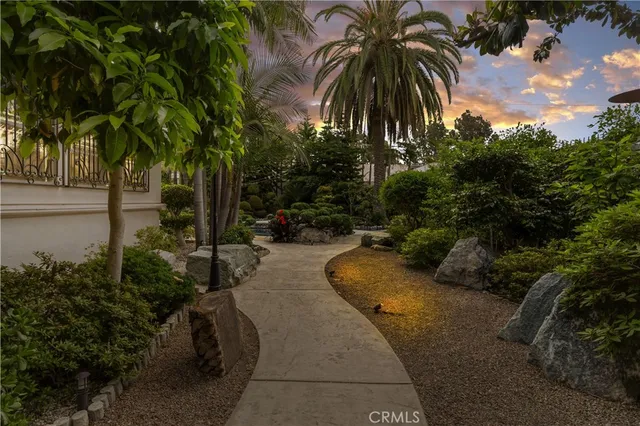 a view of a patio with table and chairs and potted plants