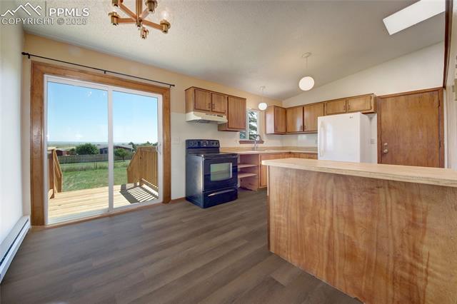 18535 Sage Crest Road Peyton, CO 80831 - Photo 2 of 24 Sliding glass doors from kitchen eating area to back yard