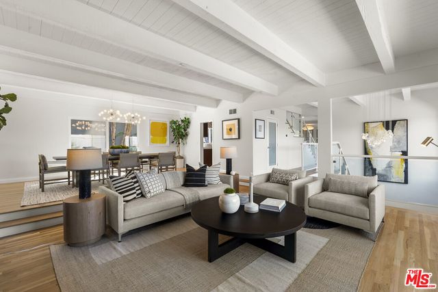 a living room with furniture and a table