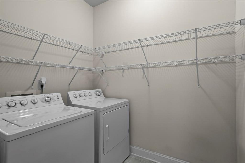 4250 Granby Circle Cumming, GA 30041 - Photo 19 of 37 a utility room with dryer and washer