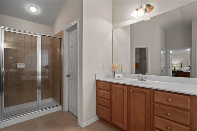 a bathroom with a granite countertop sink mirror and double