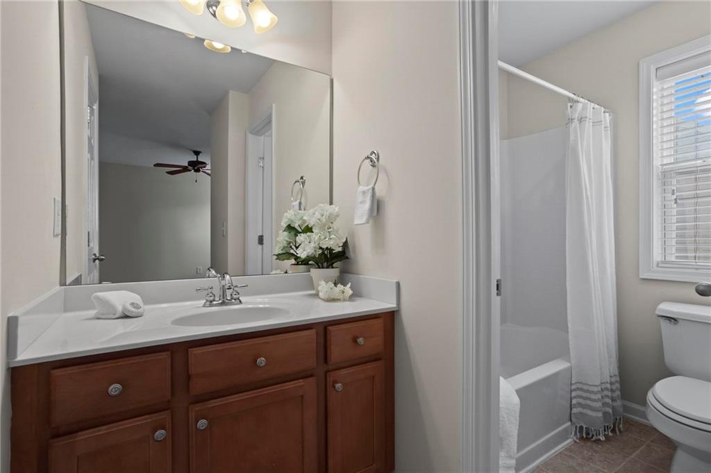 4250 Granby Circle Cumming, GA 30041 - Photo 28 of 37 a bathroom with a sink a toilet and shower