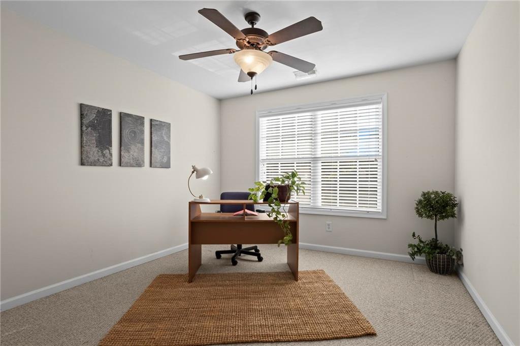 4250 Granby Circle Cumming, GA 30041 - Photo 29 of 37 a living room with furniture and a potted plant