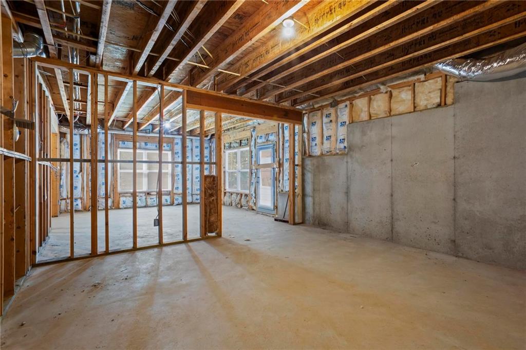 4250 Granby Circle Cumming, GA 30041 - Photo 32 of 37 a view of an empty room with wooden walls