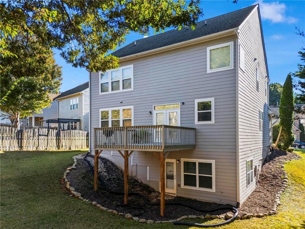 4250 Granby Circle Cumming, GA 30041 - Photo 34 of 37 a front view of a house with garden