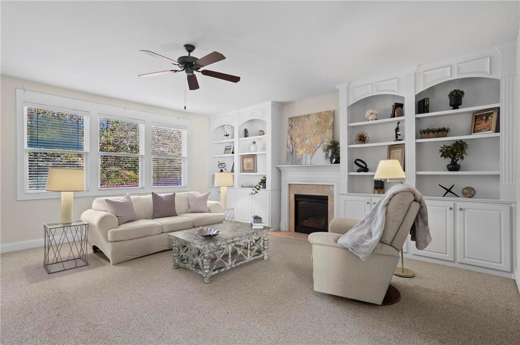 4250 Granby Circle Cumming, GA 30041 - Photo 9 of 37 a living room with furniture fireplace and a large window