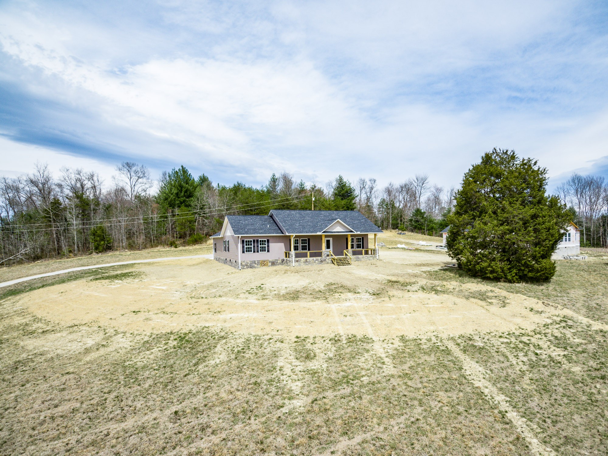 133 Cardinal Way Lancing, TN 37770 - Photo 2 of 35 a view of a house with a yard and sitting area