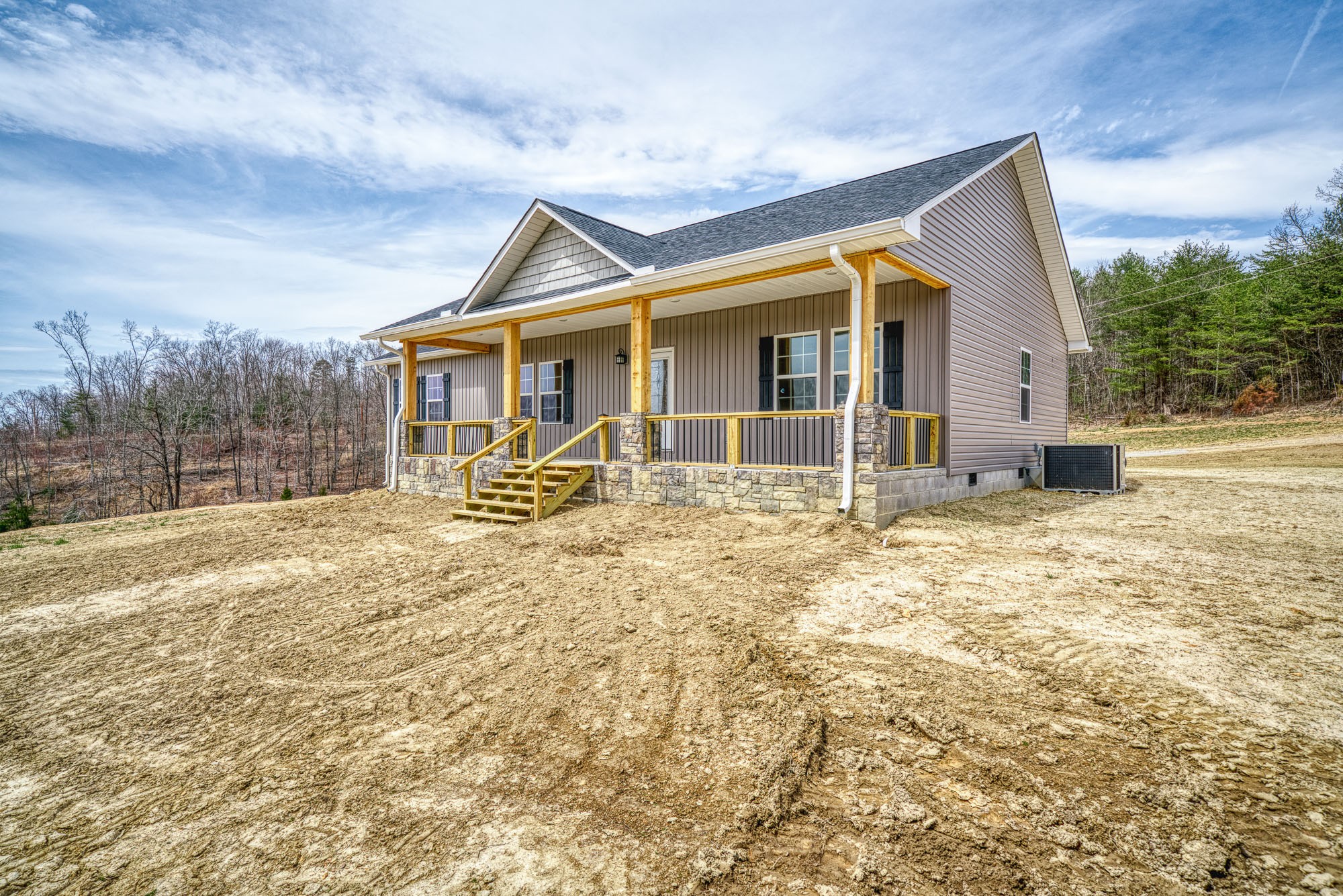 133 Cardinal Way Lancing, TN 37770 - Photo 4 of 35 a backyard of a house with table and chairs