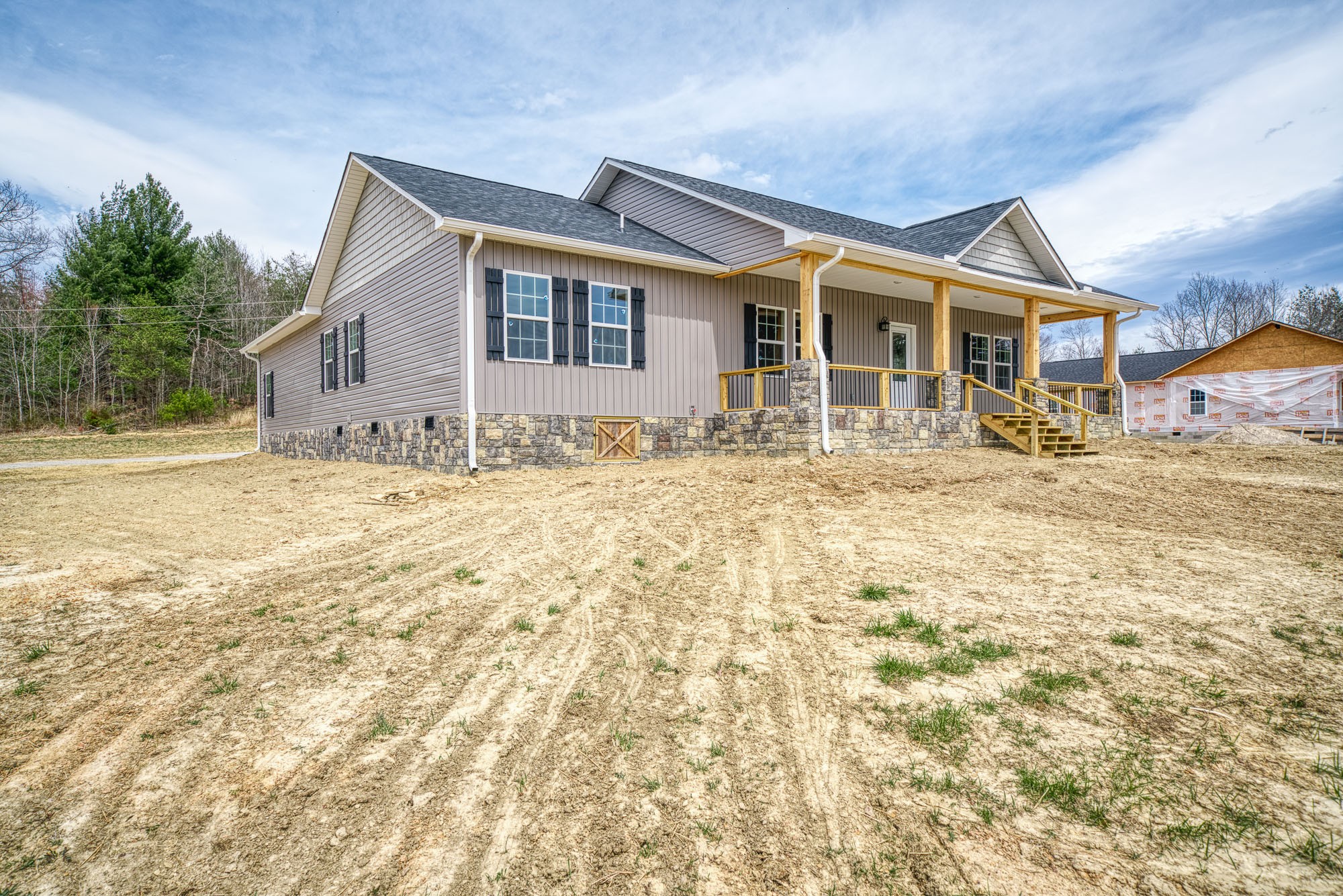 133 Cardinal Way Lancing, TN 37770 - Photo 5 of 35 a front view of a house with a yard