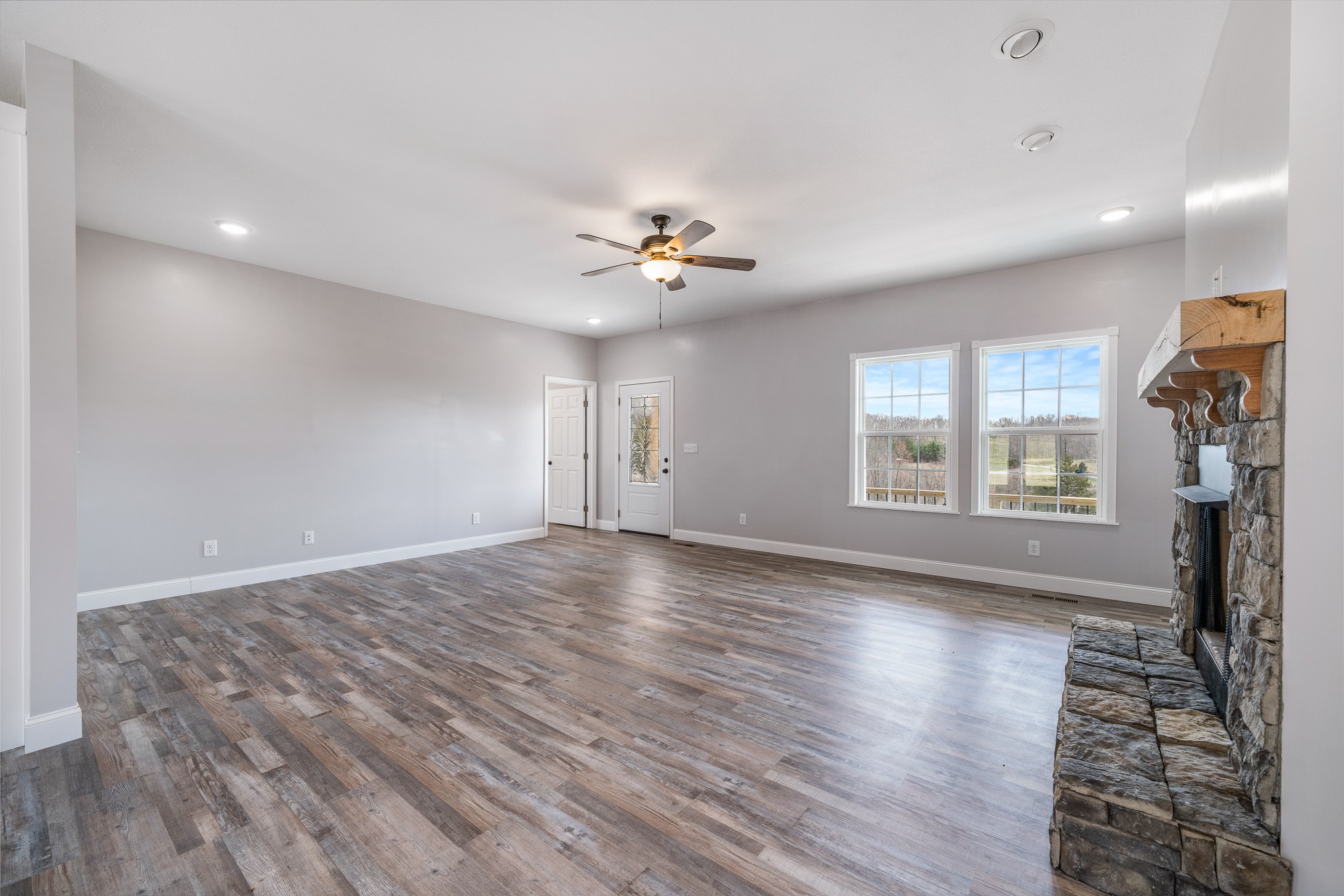 133 Cardinal Way Lancing, TN 37770 - Photo 6 of 35 a view of an empty room with a window and wooden floor