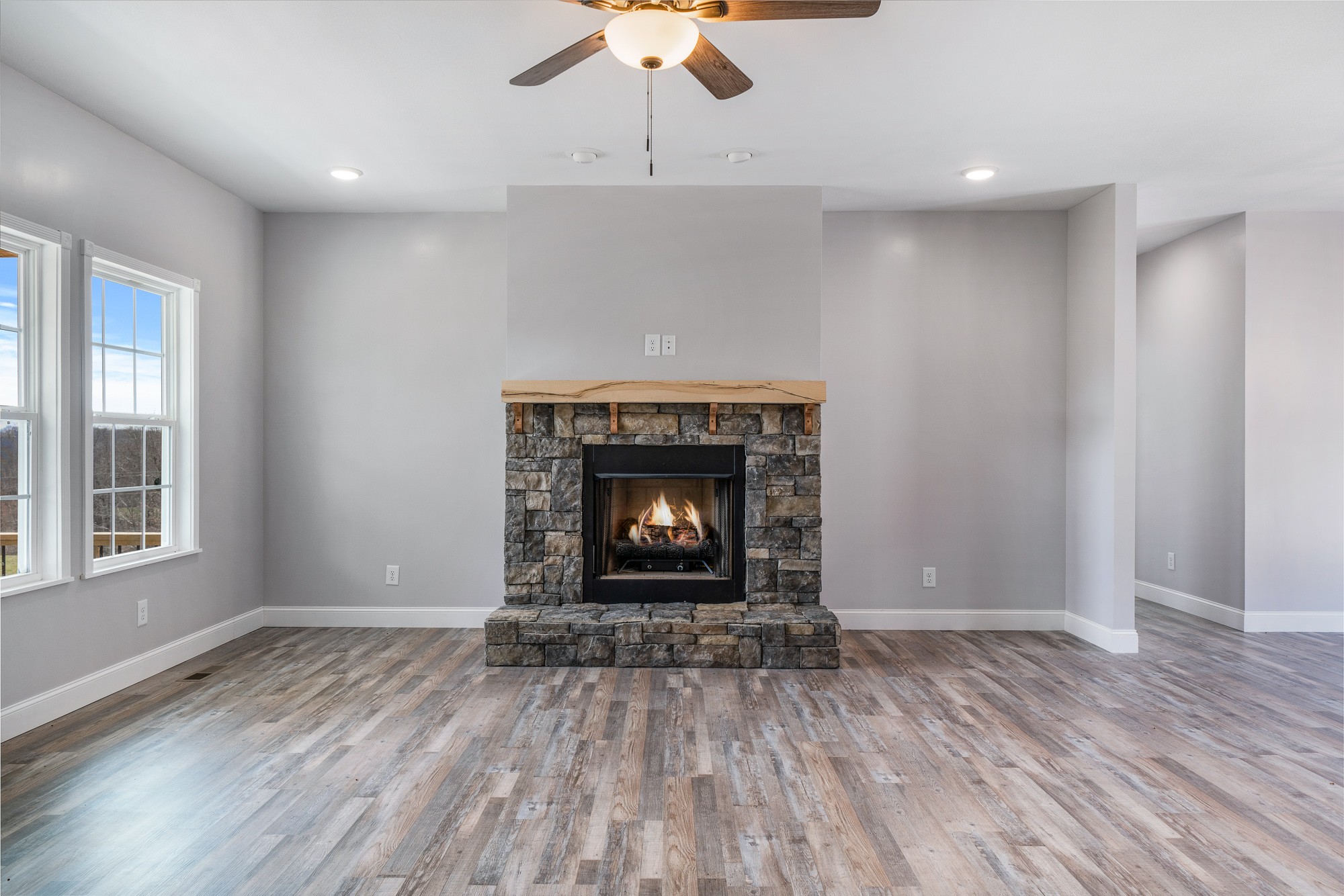 133 Cardinal Way Lancing, TN 37770 - Photo 7 of 35 wooden floor fireplace and window in an empty room