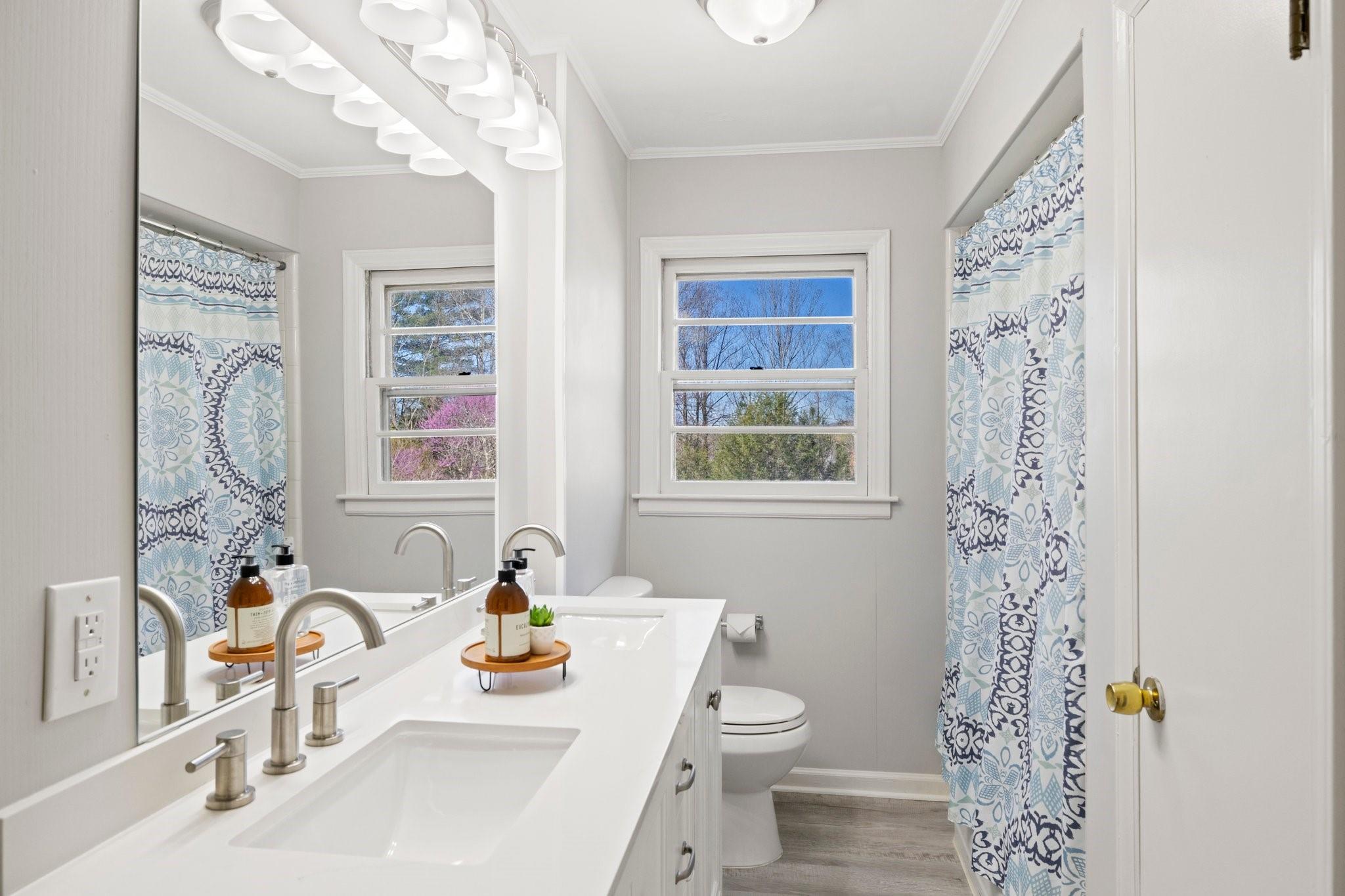 480 Loop Road Hendersonville, NC 28792 - Photo 14 of 26 a bathroom with a sink toilet and shower