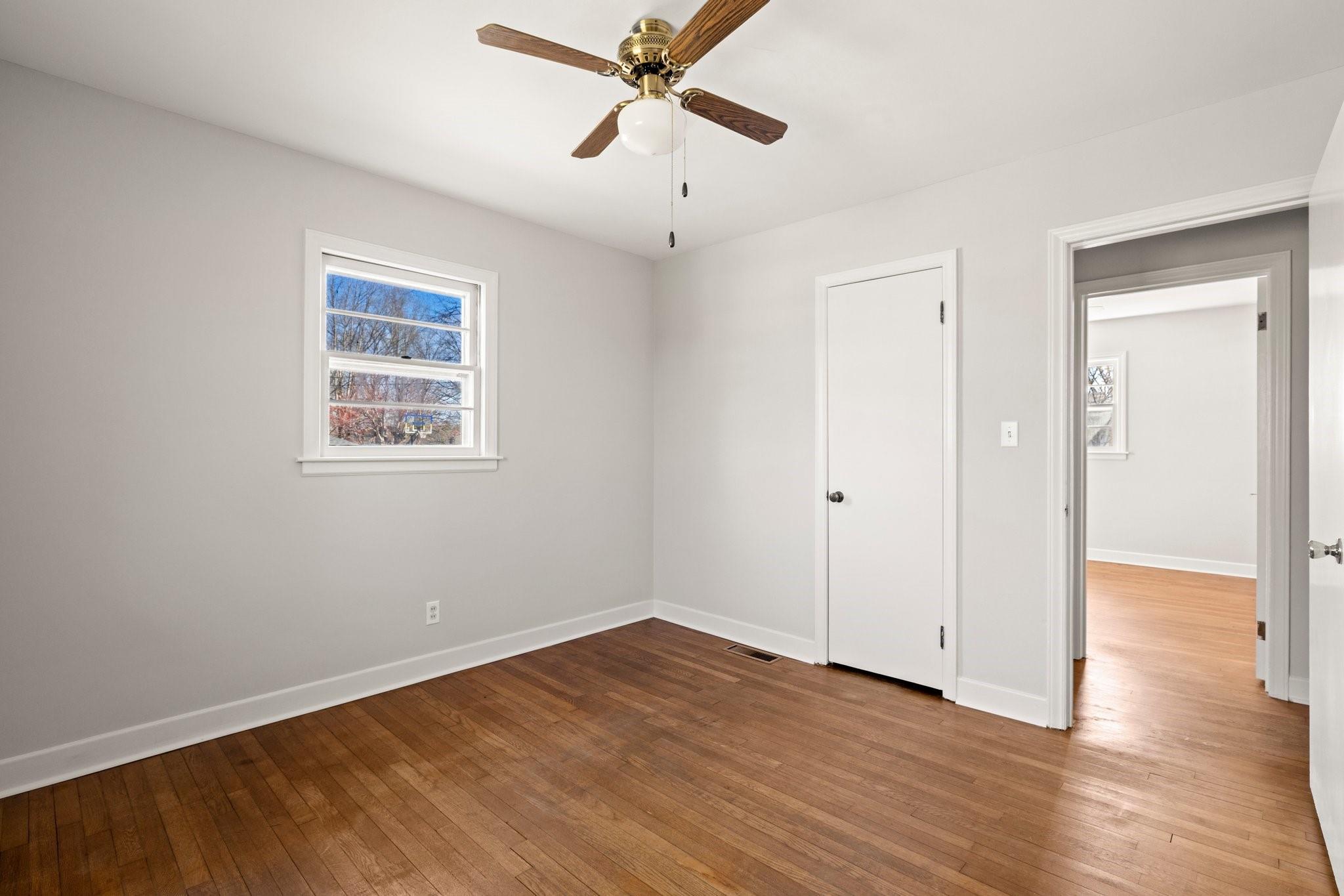 480 Loop Road Hendersonville, NC 28792 - Photo 17 of 26 a view of an empty room with wooden floor