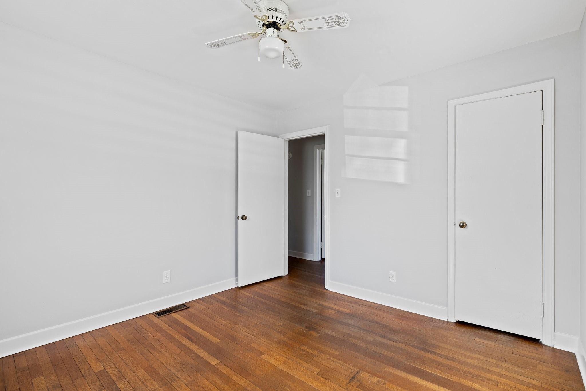 480 Loop Road Hendersonville, NC 28792 - Photo 19 of 26 a view of an empty room with wooden floor