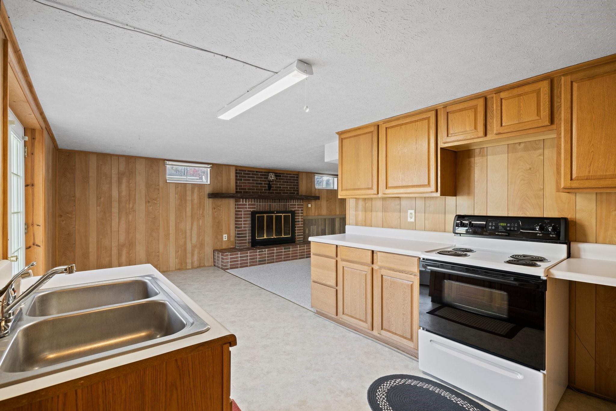 480 Loop Road Hendersonville, NC 28792 - Photo 22 of 26 a kitchen that has a sink and a stove top oven