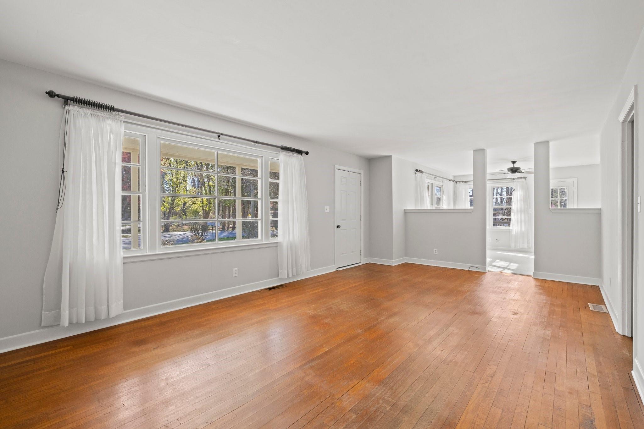 480 Loop Road Hendersonville, NC 28792 - Photo 5 of 26 a view of empty room with wooden floor and window