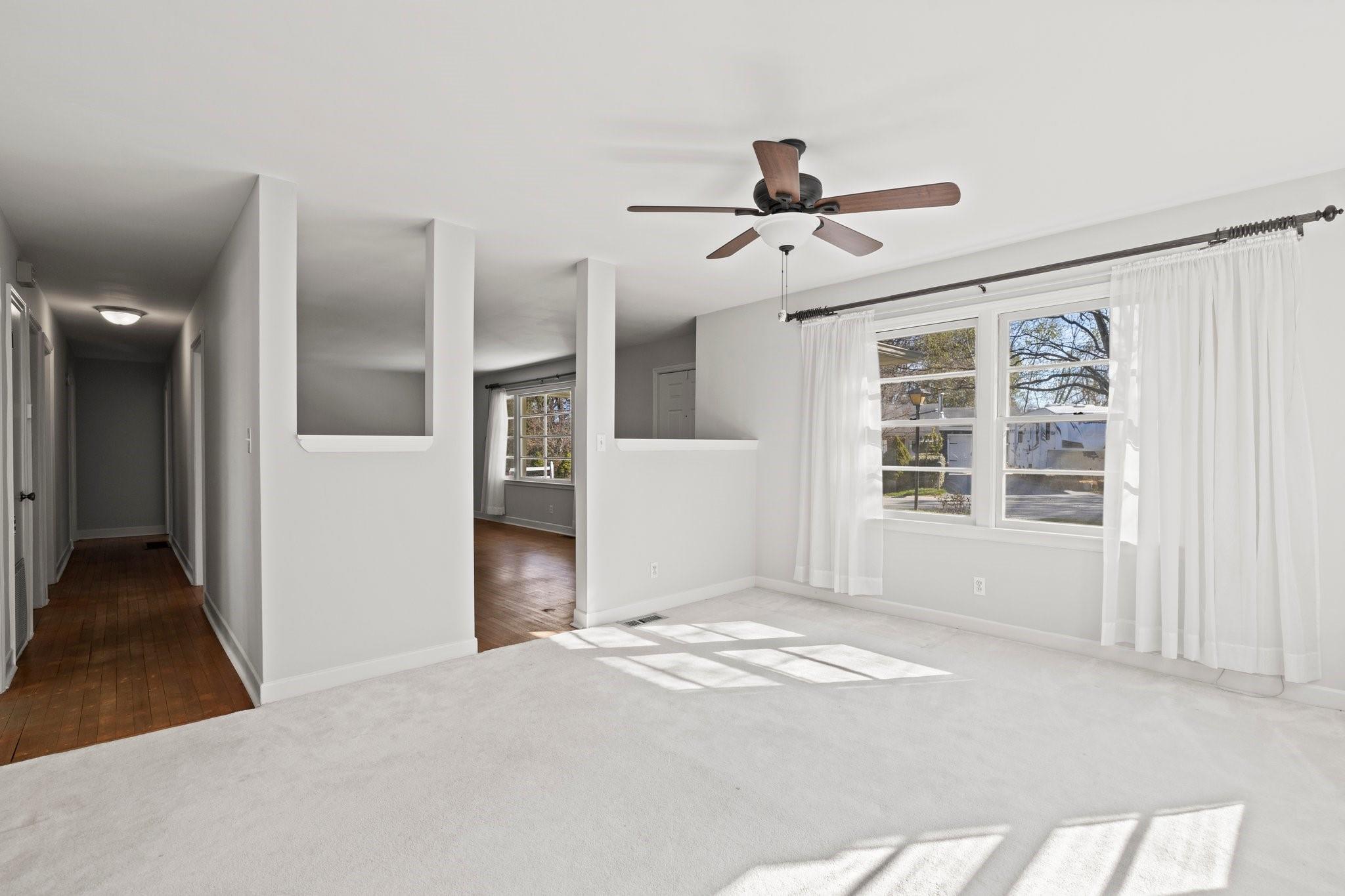 480 Loop Road Hendersonville, NC 28792 - Photo 8 of 26 a view of empty room with windows and ceiling fan