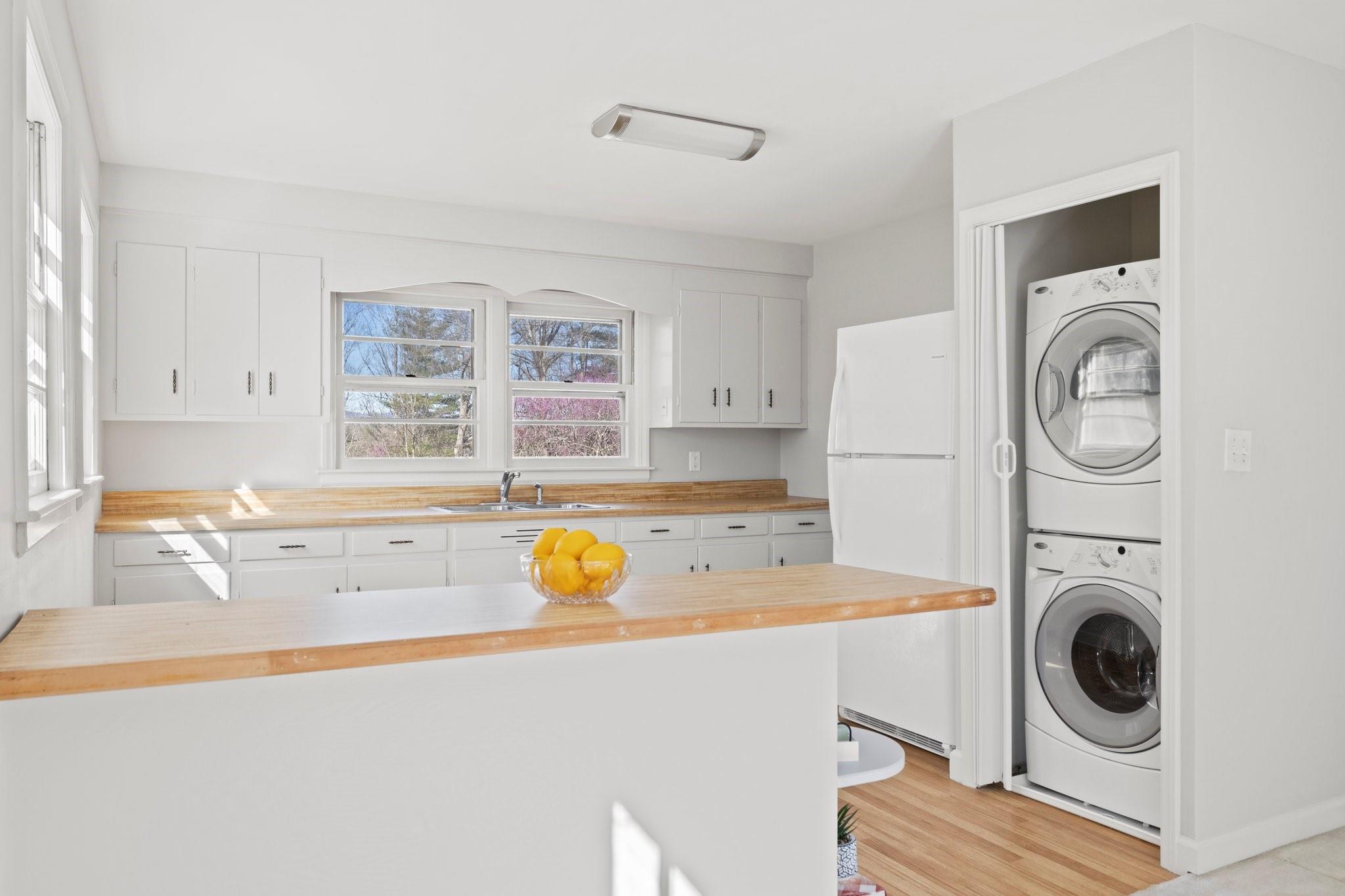 480 Loop Road Hendersonville, NC 28792 - Photo 10 of 26 a view of a kitchen with a sink and washer dryer