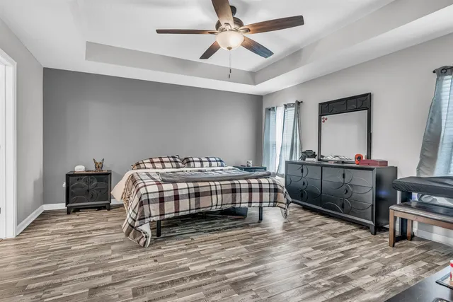 a bathroom with a tub shower and a sink
