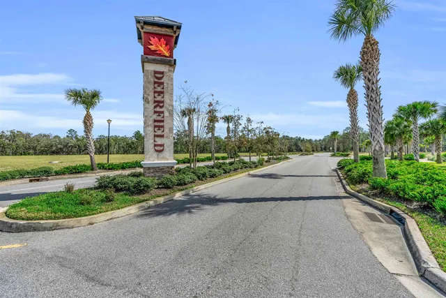 a swimming pool with outdoor seating and yard