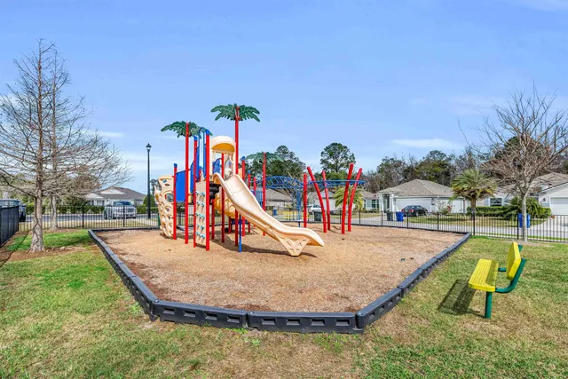 a view of an entryway with a table and chairs