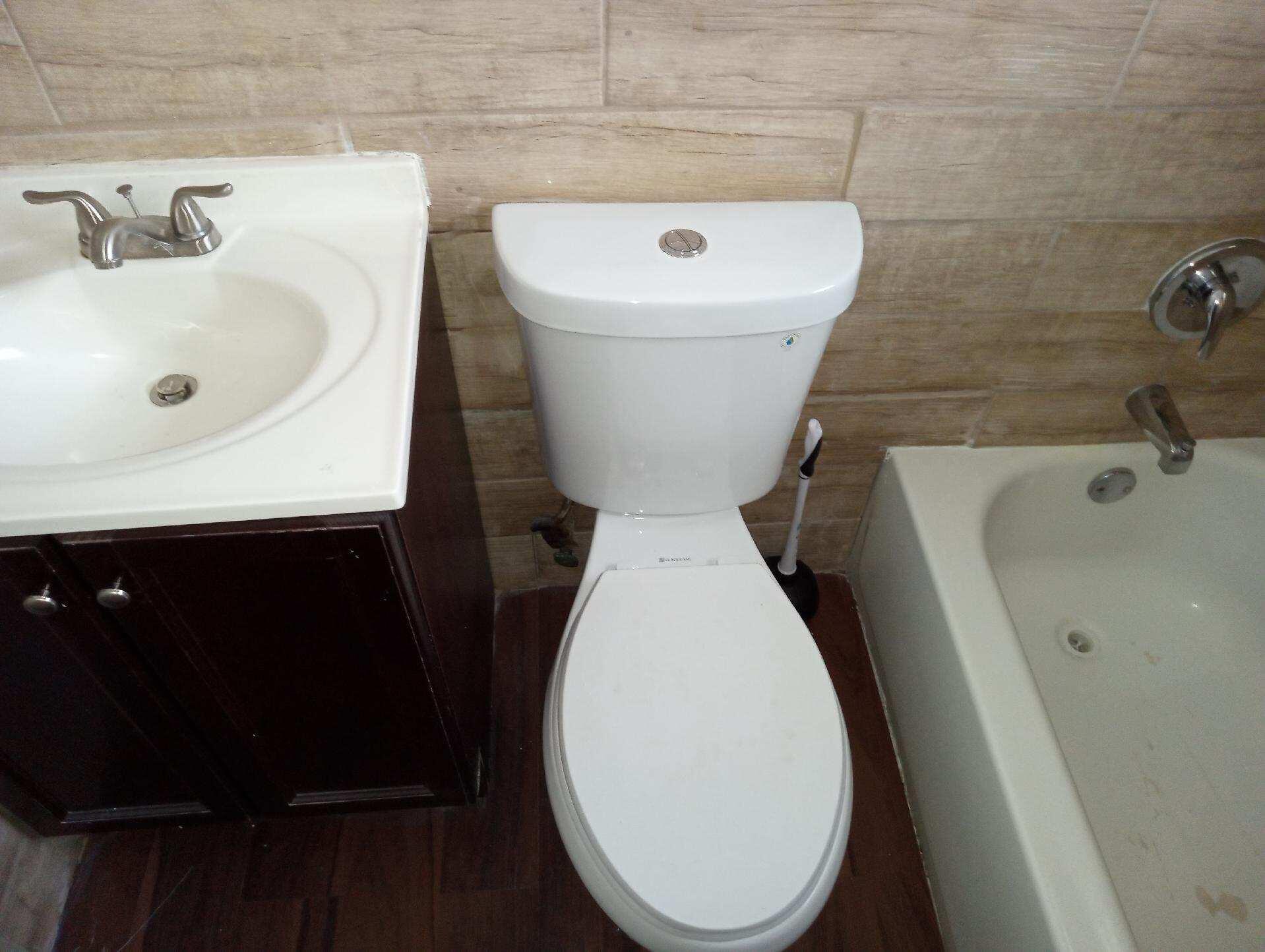 305 Northwest 4th Avenue Delray Beach, FL 33444 - Photo 13 of 45 a bathroom with a toilet sink and mirror