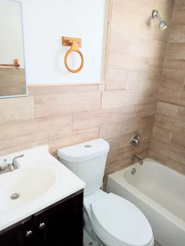a bathroom with a toilet a sink and a bathtub