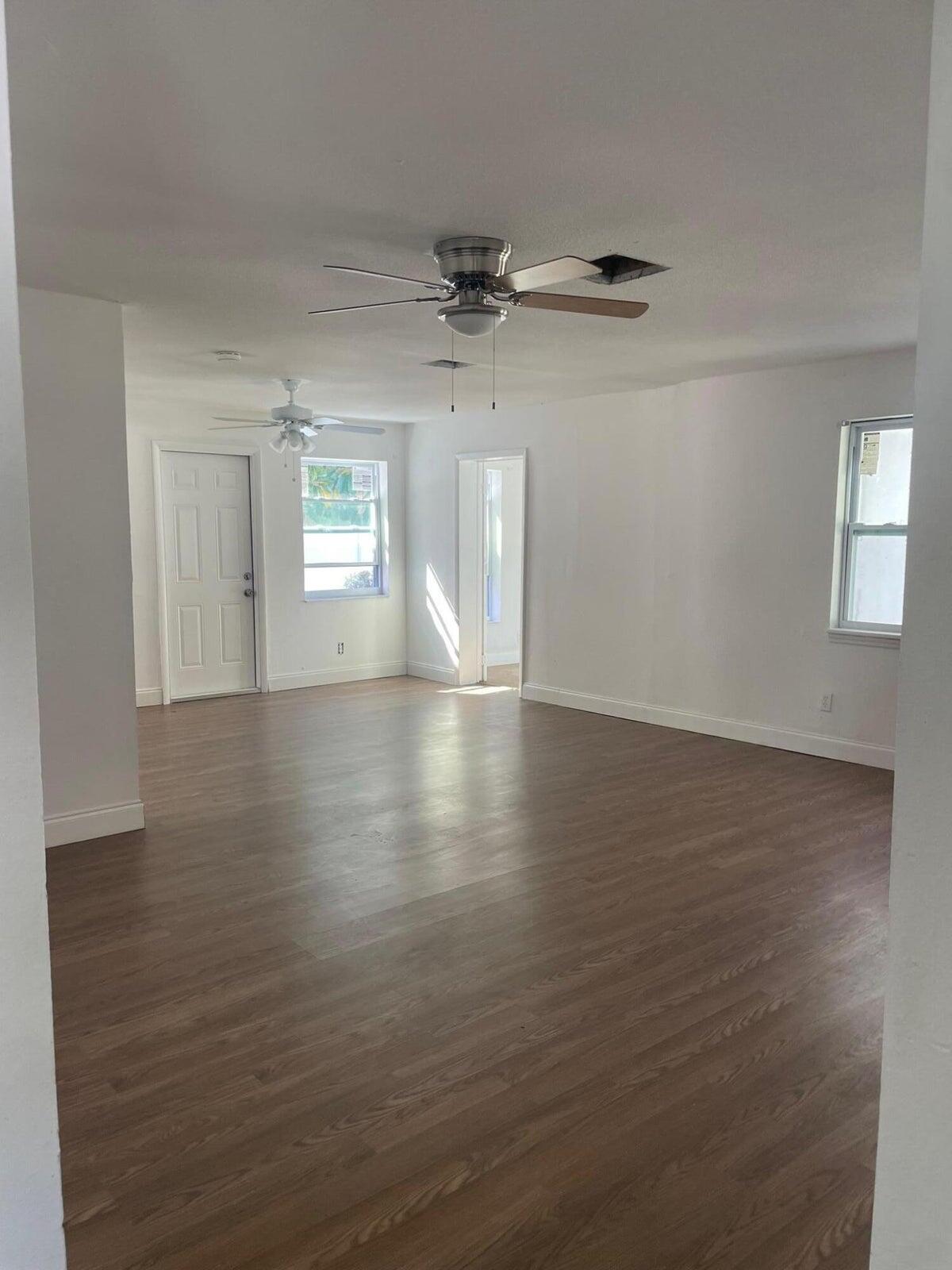 305 Northwest 4th Avenue Delray Beach, FL 33444 - Photo 29 of 45 an empty room with wooden floor and windows