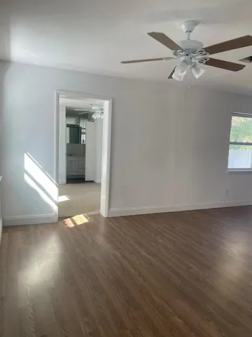 a white toilet sitting next to a white sink
