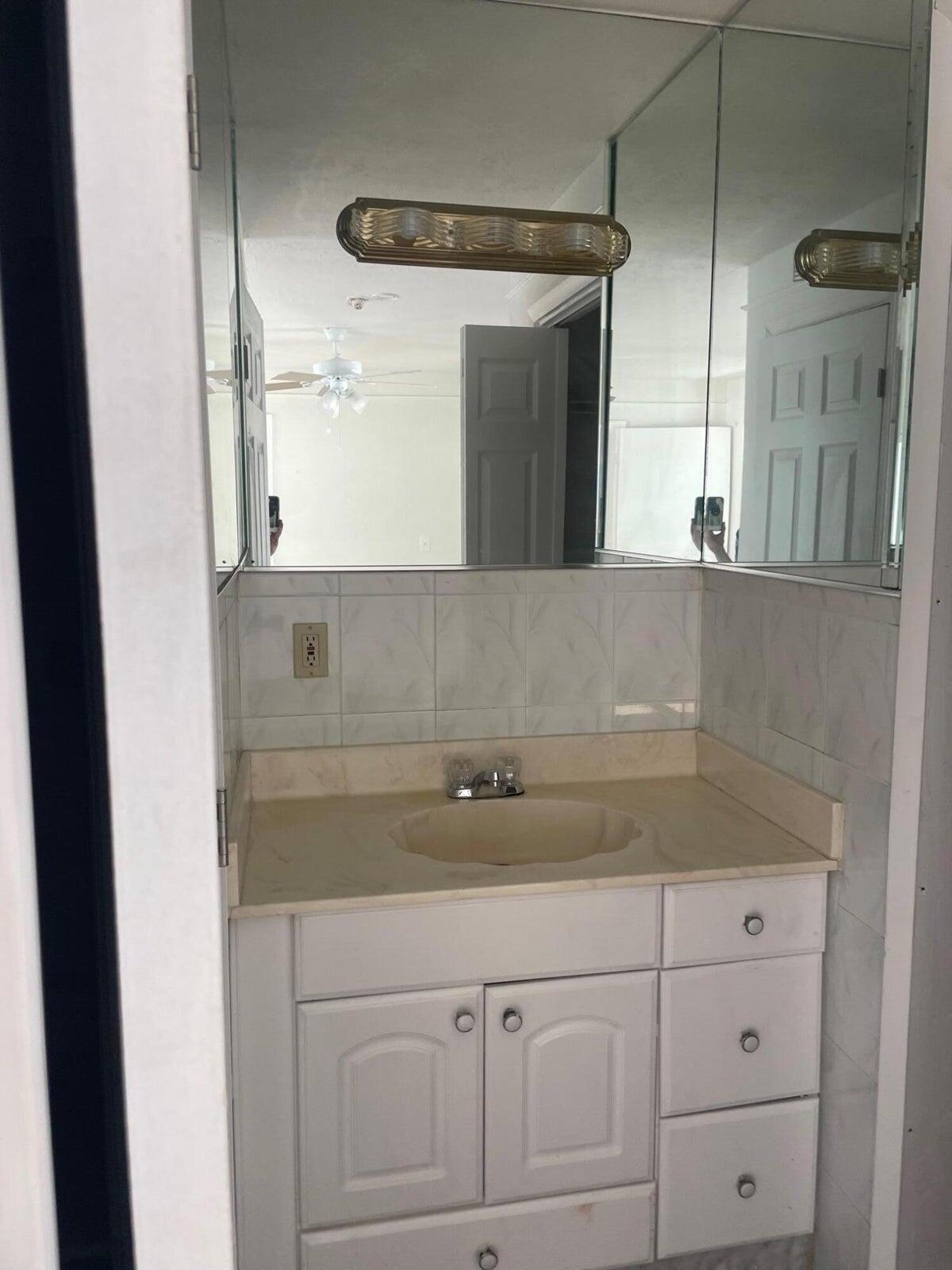 305 Northwest 4th Avenue Delray Beach, FL 33444 - Photo 40 of 45 a sink with a granite countertop window