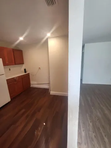 a kitchen with a sink a stove and cabinets