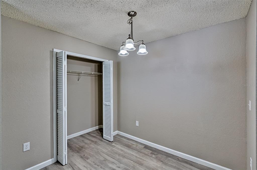 3705 Southwest 27th Street, Unit 926 Gainesville, FL 32608 - Photo 12 of 39 wooden floor in an empty room with a window
