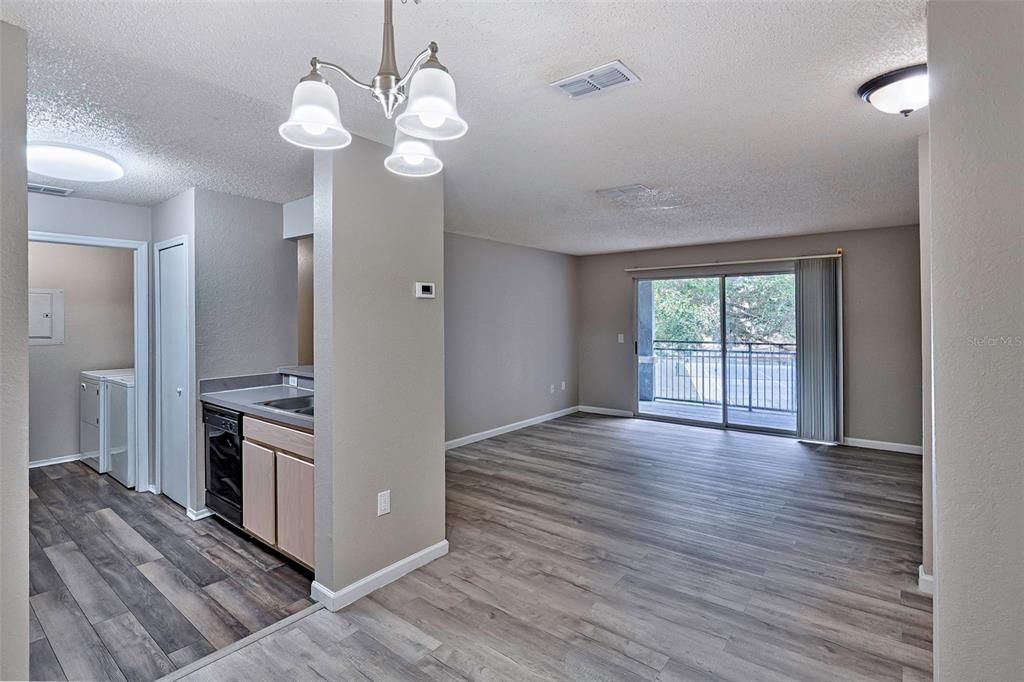 3705 Southwest 27th Street, Unit 926 Gainesville, FL 32608 - Photo 13 of 39 wooden floor in an empty room with a window