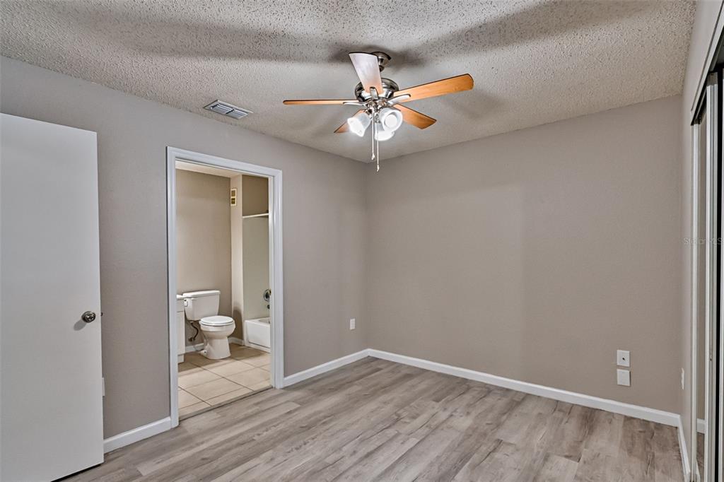 3705 Southwest 27th Street, Unit 926 Gainesville, FL 32608 - Photo 19 of 39 wooden floor in an empty room with a window