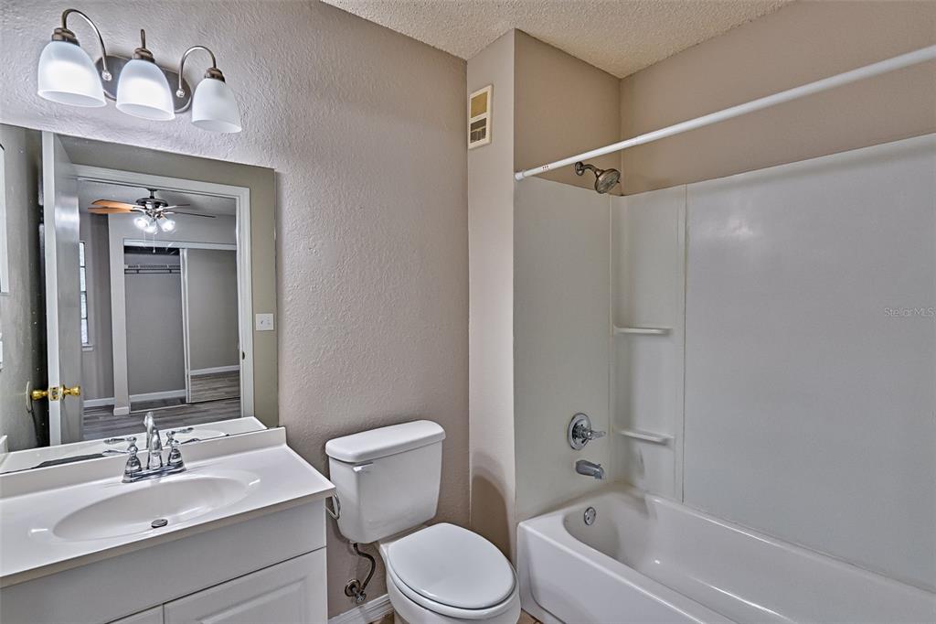 3705 Southwest 27th Street, Unit 926 Gainesville, FL 32608 - Photo 24 of 39 a bathroom with a sink toilet and shower
